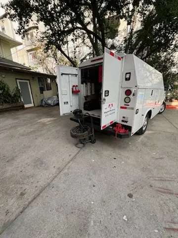 Magnet Plumbing service vehicle on-site for Grease Trap Cleaning in Silver Fern Estates
